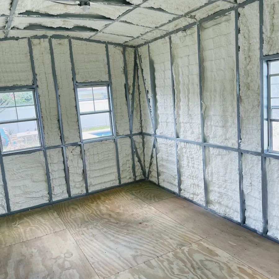 Closed-cell spray foam insulation applied to wall cavities in a residential project in Allen